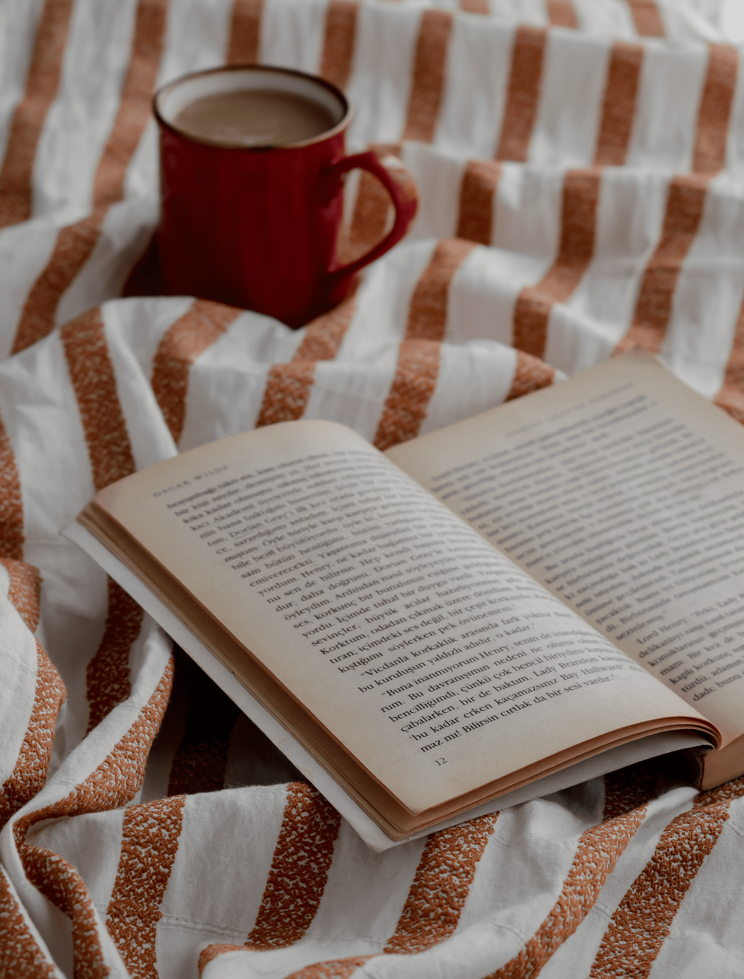A coffee mug with an opened book