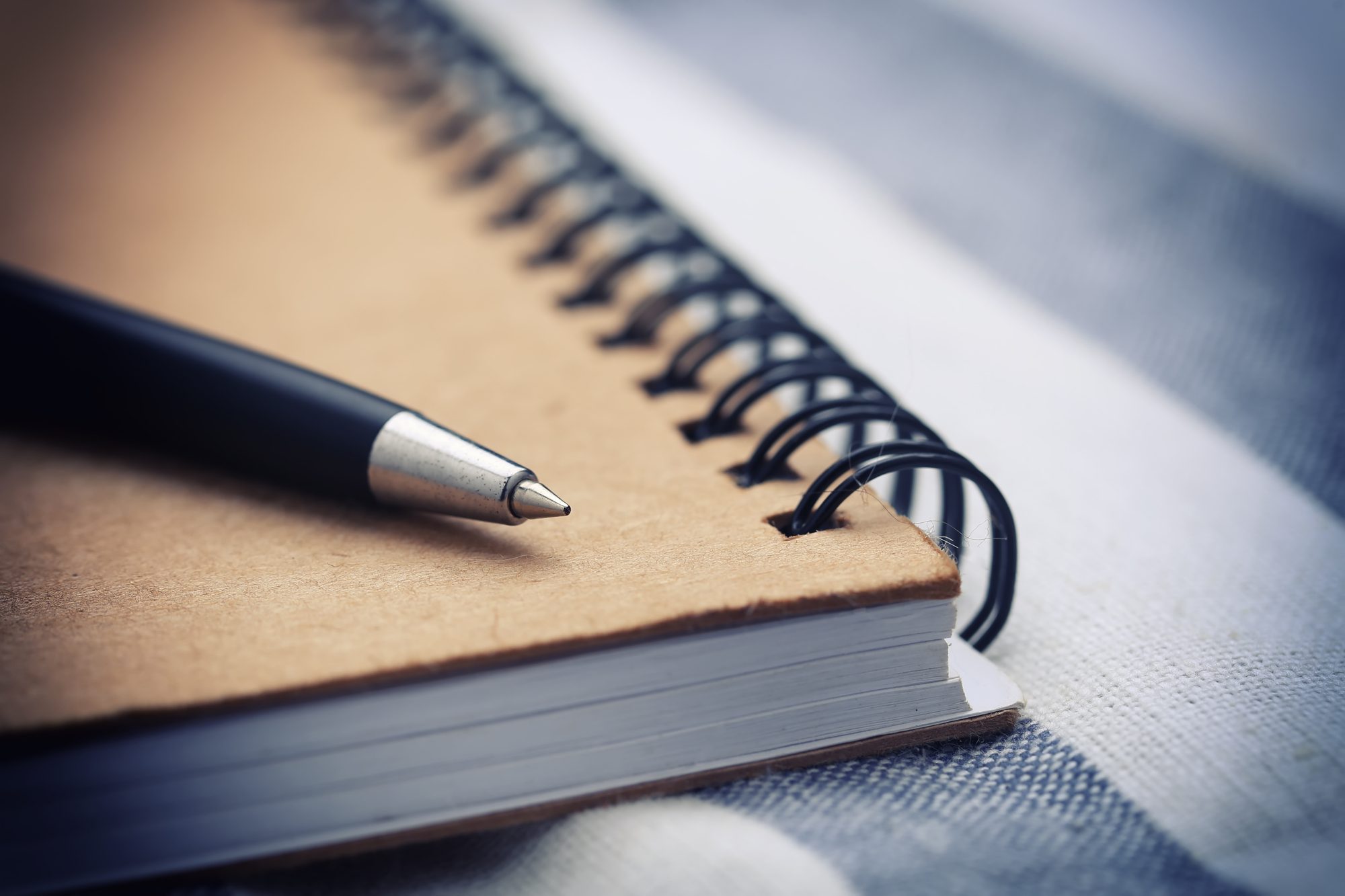 Close-up of a pen and notebook